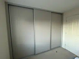 3 plain panel doors with an addition hidden mirror door behind, fitted in Ingleby Barwick